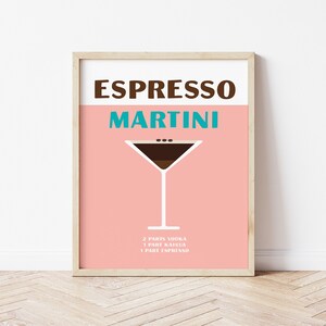May include: A pink and white poster with the text "Espresso Martini" in brown and teal lettering. A martini glass with a brown liquid and coffee beans is shown. The recipe is listed below: 4 parts vodka, 1 part Kahlua, 1 part espresso.