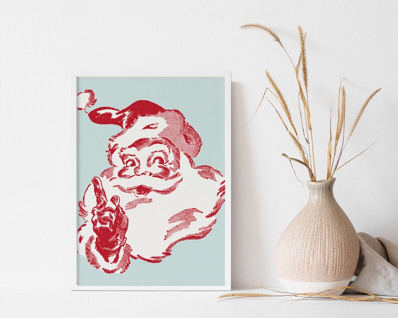 May include: A vintage-style illustration of Santa Claus with a red beard and hat, against a light blue background. He is smiling and pointing with his right index finger.