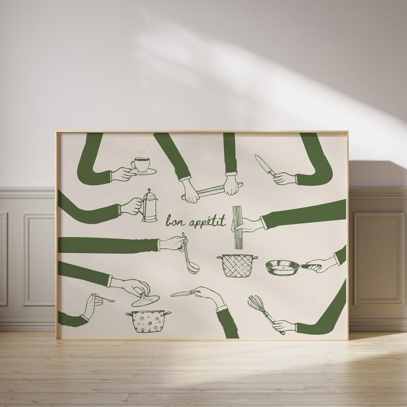 May include: A framed print featuring a beige background with green illustrations of hands holding various kitchen tools. The phrase "bon app&eacute;tit" is written in cursive. The tools include a coffee cup, a French press, a knife, and a whisk.