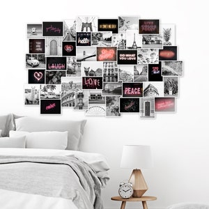 May include: A black and white photo collage featuring various images and text, including "laugh", "love", "peace", and "do what you love". The collage is displayed on a white wall above a gray bed with white bedding.