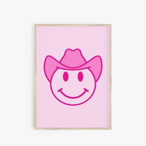 May include: Pink smiley face with a pink cowboy hat on a pink background. The smiley face is outlined in a darker pink.