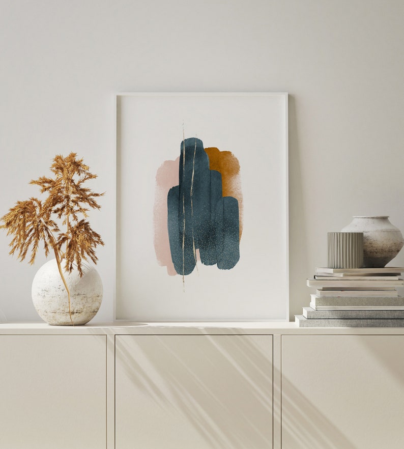 May include: Abstract art print with a white background and a design of overlapping shapes in shades of pink, brown, and blue. The shapes are painted in a watercolor style and have a textured look.