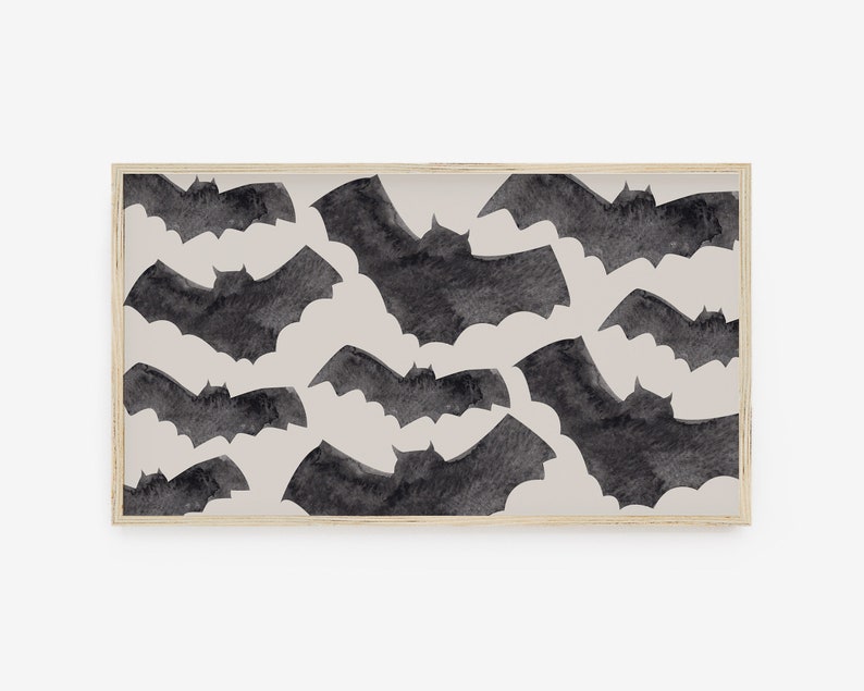 May include: A framed print with a beige background and a pattern of black watercolor bats.