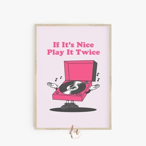 May include: Pink and black illustration of a record player with the text "If It's Nice Play It Twice".