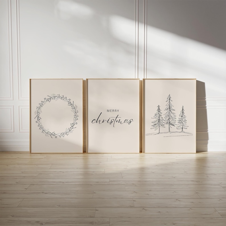 May include: Set of three minimalist Christmas prints featuring a wreath, the text "Merry Christmas", and a line drawing of three pine trees.