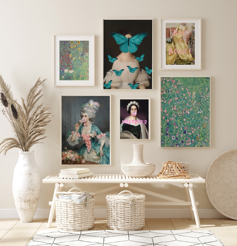 May include: A collection of framed art prints displayed on a white bench. The prints feature various styles, including floral, portraiture, and abstract designs. The color palette includes greens, blues, pinks, and yellows, creating a visually appealing gallery wall.