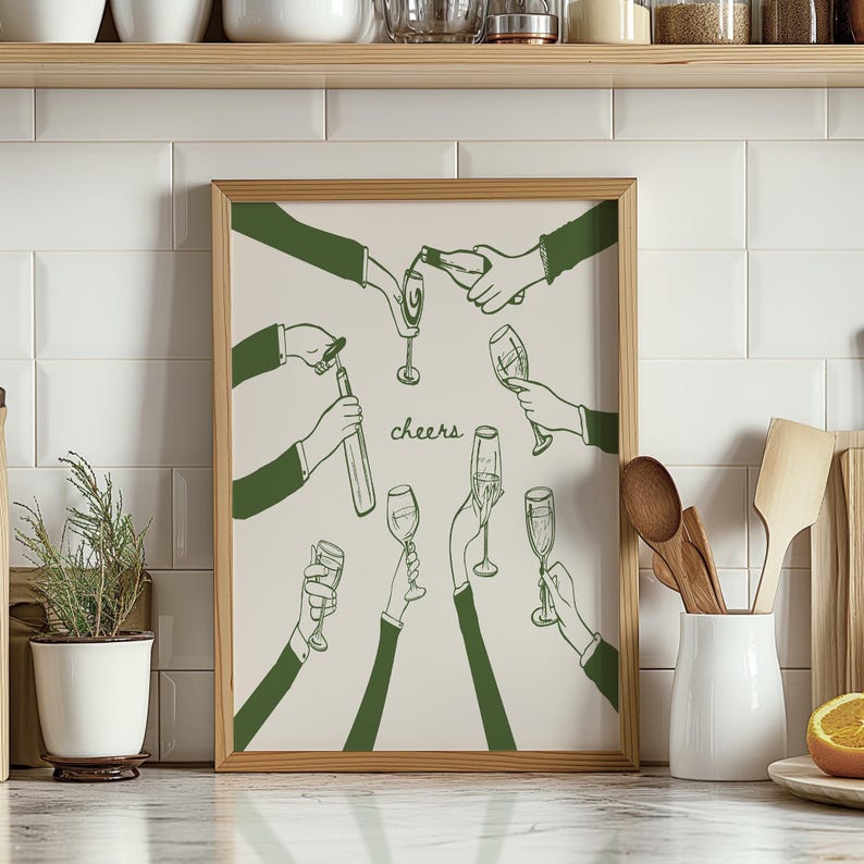 May include: A framed illustration of a group of people raising their glasses in a toast. The illustration is in green and white and features the word "cheers" in the centre.