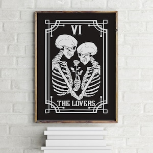 May include: Black and white illustration of two skeletons holding a rose, with the text "VI THE LOVERS" in a decorative frame.