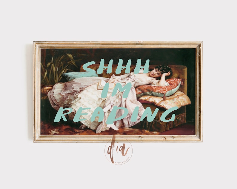 May include: A framed painting of a woman reclining on a sofa, reading a book. The text "SHHH I'M READING" is superimposed on the image in a light blue colour.