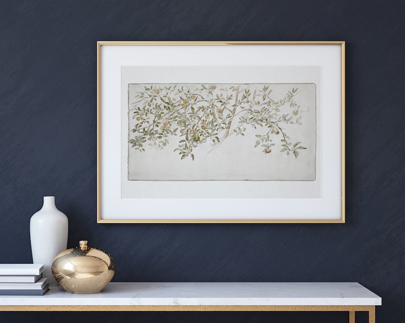 May include: A framed watercolor painting of a branch of a tree with green leaves and small yellow fruit. The painting is on a white background and is framed in a gold frame.