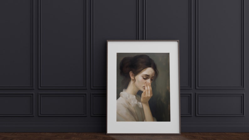 May include: A framed painting of a woman with brown hair, wearing a white blouse, looking down with her hand covering her face. The background is a muted green.