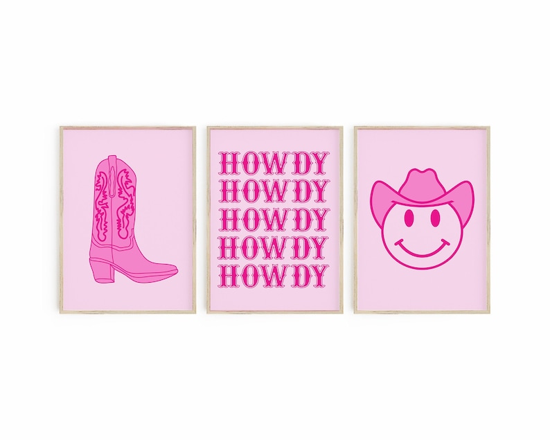 May include: Three pink framed prints with a pink cowboy boot, the word "HOWDY" repeated five times, and a pink smiley face wearing a cowboy hat.