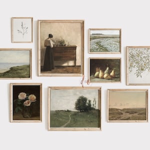 May include: A gallery wall featuring nine framed prints with various subjects, including landscapes, still life, and botanical illustrations. The prints are all in a similar style, with a light brown frame and a white mat.