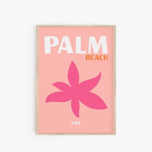 May include: A pink and orange framed print with the text "PALM BEACH USA" and a pink stylized flower graphic.