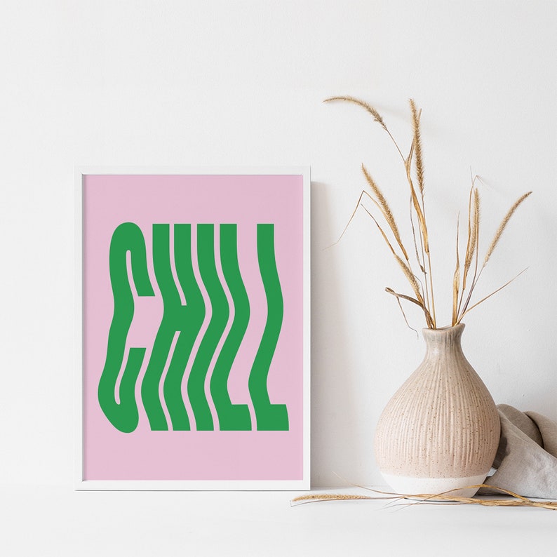 May include: A framed print with a pink background and the word "CHILL" in green, wavy letters.