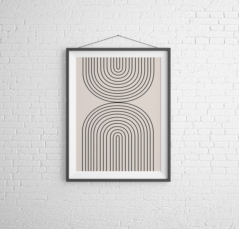 May include: A framed print with a minimalist geometric design featuring black arches on a light beige background.