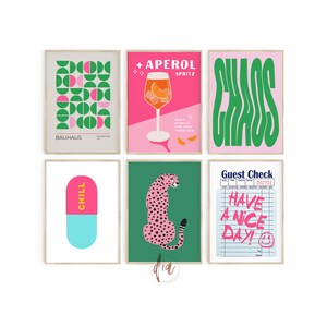 May include: Set of six printable wall art prints featuring a variety of designs, including geometric shapes, a cocktail glass, a cheetah, a pill, and a guest check. The prints are in a modern style with bright colors like pink, green, and yellow.