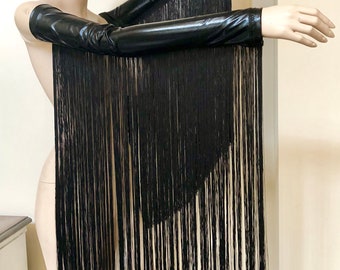 May include: A pair of black long-sleeved gloves with fringe. The gloves are made of a shiny, stretchy material.