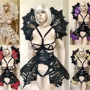 May include: Five different lingerie sets with lace detailing. Each set includes a bra, garter belt, and matching lace shoulder pieces. The sets are in black, white, gold, purple, and red.