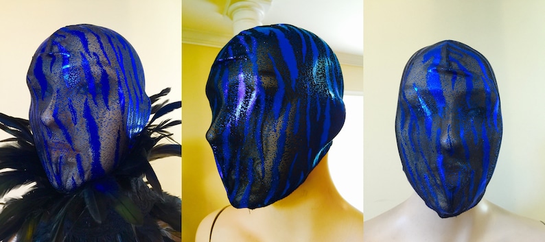 May include: A blue and black patterned mesh face mask. The mask is made of a stretchy material and covers the entire head. The pattern is a zebra print.