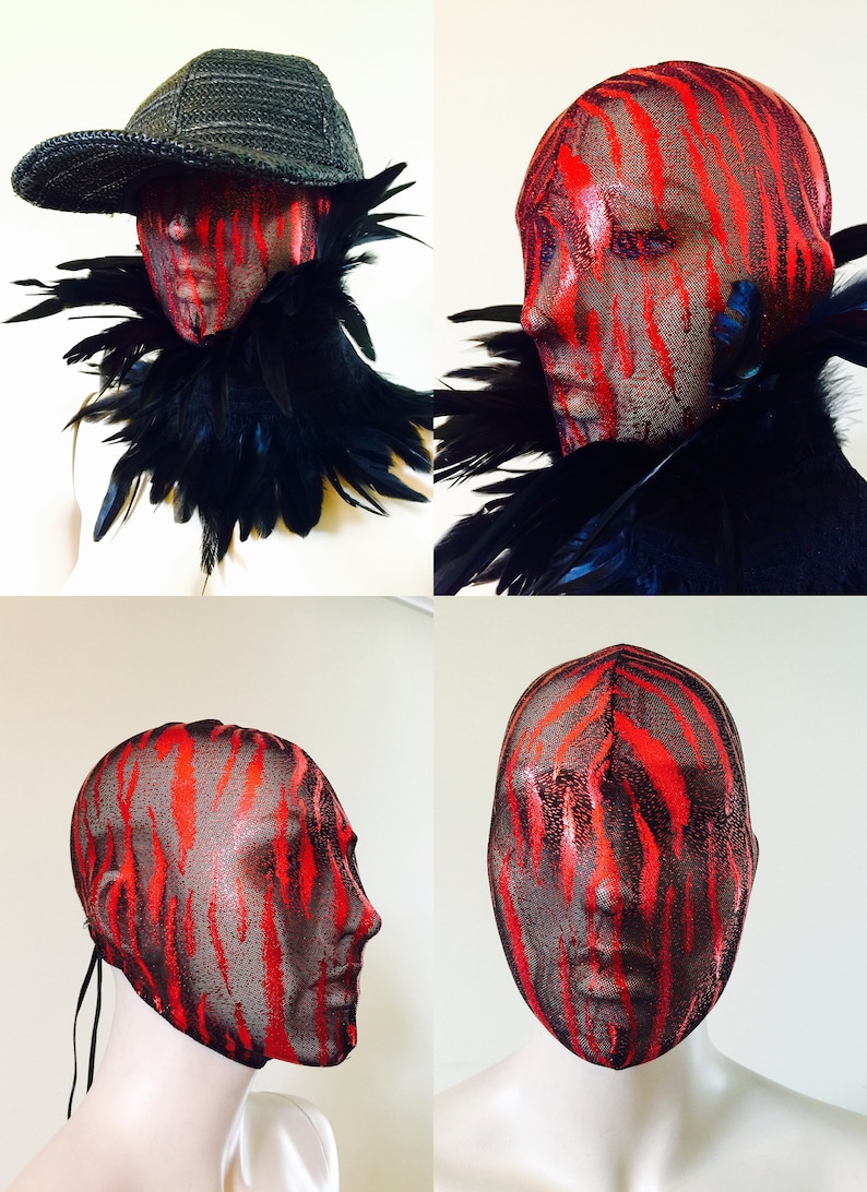 May include: A red and black patterned mesh mask covers a mannequin's head. The mask has a tie at the back of the neck. The mask is shown from the front, side, and back.