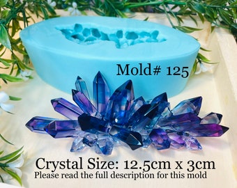 May include: A blue silicone mold for making a crystal cluster. The mold is shaped like a cluster of crystals and is 12.5 cm wide and 3 cm tall. Mold # 125.