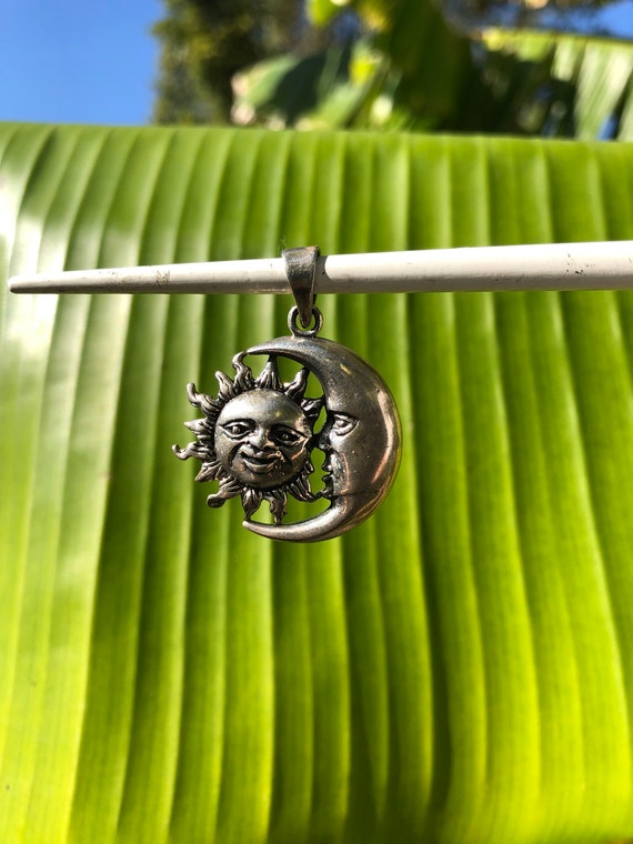 Vintage silver sun and crescent moon faces pendant