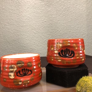 Vintage pair of hand painted ceramic Japanese? Teacups/ matcha tea bowls, two teacups autumn rust orange with black flowers earth tone dots