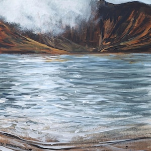 May include: An acrylic painting depicting a mountain lake. The water is light blue with white highlights, and the mountains are brown and orange. The sky is cloudy white, and the foreground shows a sandy shore with rocks.