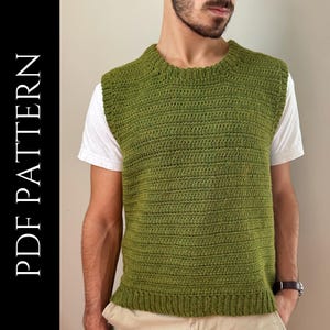 May include: A green crocheted sleeveless vest with a round neckline. The vest is made with a simple stitch pattern and has a ribbed hem.