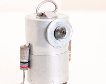 Little metal NOBOT robot sculpture