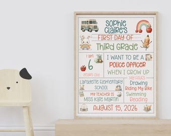 May include: A framed, colorful first day of school sign for Sophie Claire's third grade. The sign includes a bus, rainbow, apple, and bunny illustrations. It states "I am 6 years old" and "I want to be a police officer". The sign also lists favorite activities.