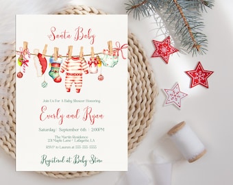 May include: A baby shower invitation with the text "Santa Baby" and watercolor illustrations of Christmas-themed baby clothes hanging on a clothesline. The invitation includes the names Everly and Ryan, date, time, and location.
