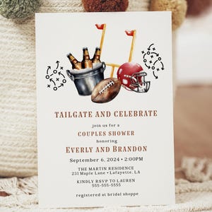 May include: Invitation card with a watercolor illustration of football-themed elements. The design includes a football, a red helmet, a bucket of beer, and play diagrams. Text reads "TAILGATE AND CELEBRATE" and details for a couples shower honoring Everly and Brandon.