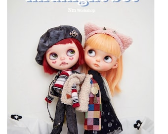 May include: Two dolls are featured in this image, each dressed in stylish outfits. One doll wears a beret, a striped jacket, and jeans. The other doll has a cat-ear headband and a black dress. The text "midnight set" is at the top.