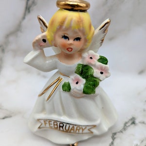 Vintage February Birthday Angel Price Imports?