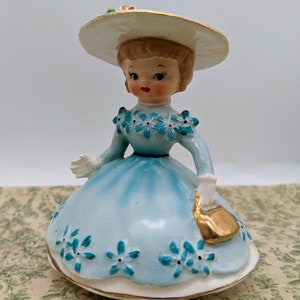 Napco Miss Dainty Lady in Teal Dress with Gold Purse 1956