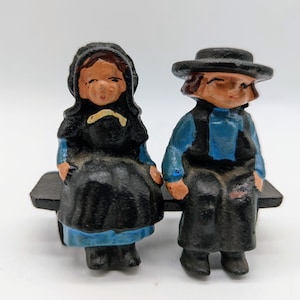 Miniature Cast Iron Amish Man and Woman Sitting on Bench Figures
