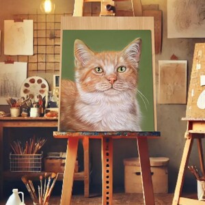 May include: A detailed painting of a ginger cat with white fur on a green background, displayed on a wooden easel. The cat has green eyes and is the focal point. The scene is set in an artist's studio, with paintbrushes and art supplies visible.