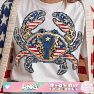 May include: White t-shirt featuring a crab design with patriotic elements. The crab's claws and body incorporate the American flag, stars, and leopard print. The design includes the text "PNG TRANSPARENT BACKGROUND" at the bottom.