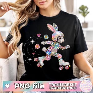 Puede incluir: Camiseta negra con un conejo de pedrería sobre patines, con casco. El conejo está adornado con gemas de colores, corazones, flores y estrellas. Las palabras "PNG file" y "Transparent Background" son visibles.