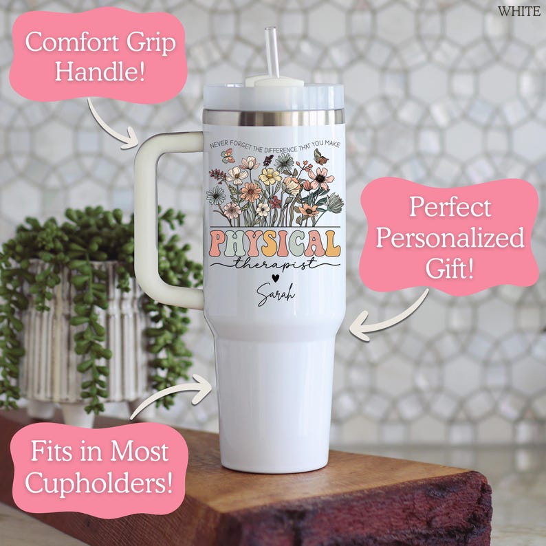 May include: White tumbler with a comfort grip handle and a straw. The tumbler features a floral design with the words "PHYSICAL therapist" and a name. The tumbler is designed to fit in most cupholders.