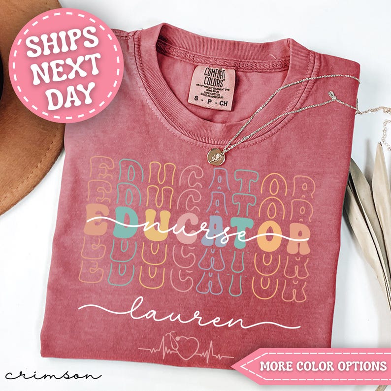 May include: Crimson-colored t-shirt with the word "EDUCATOR" repeated in a stacked design. The word "nurse" is in the center. The name "Lauren" is written in cursive. A pink circle with "SHIPS NEXT DAY" is in the upper left.