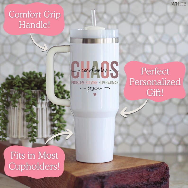 May include: White insulated tumbler with a comfort grip handle and a straw. The tumbler features the text "Chaos Coordinator Problem Solving Superwoman" with a name and a heart. It is designed to fit in most cupholders.