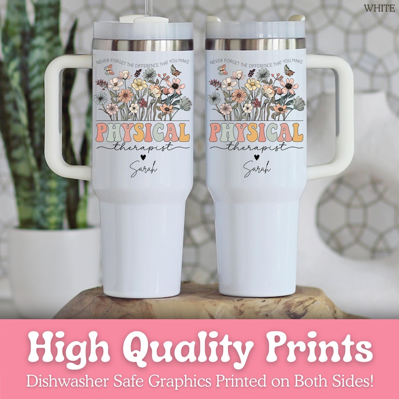 May include: Two white insulated tumblers with handles. Each tumbler features a floral design with the words "PHYSICAL therapist" and the name "Sarah". The top of the tumblers have a silver rim and a white lid. The text "NEVER FORGET THE DIFFERENCE THAT YOU MAKE" is printed above the floral design.