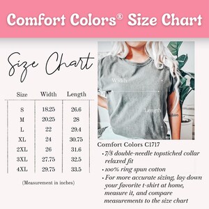 May include: A Comfort Colors size chart with measurements in inches. The chart includes sizes S to 4XL, with width and length measurements. The image also shows a gray t-shirt and text describing the shirt's features, including the collar and fabric.