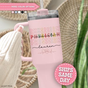 May include: A light pink stainless steel tumbler with a handle and a clear lid. The front features the repeating text 'PHYSICIAN' in a wavy font, the word 'associate' in script, the name 'lauren', and a heart icon with a stethoscope and 'PA'.
