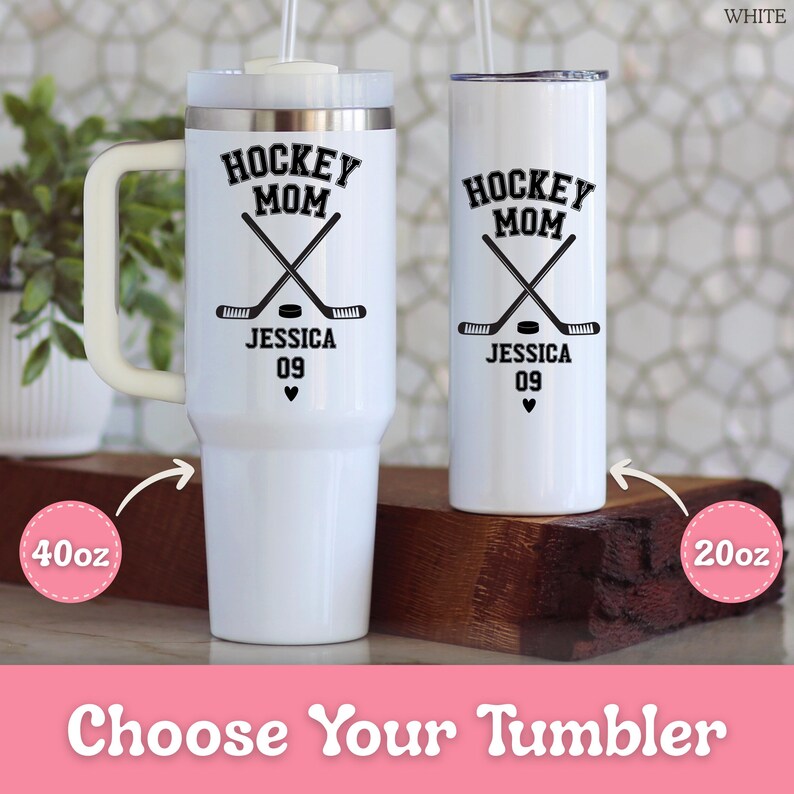 May include: Two white stainless steel tumblers with black text and graphics. One is a 40oz tumbler with a handle, the other is a 20oz slim tumbler. Both feature the text HOCKEY MOM, the name JESSICA, the number 09, a heart, and crossed hockey sticks.