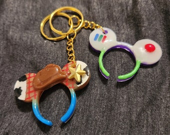 Toy Story Woody y Buzz Lightyear (brillan en la oscuridad) Llaveros BFF Minnie Ears