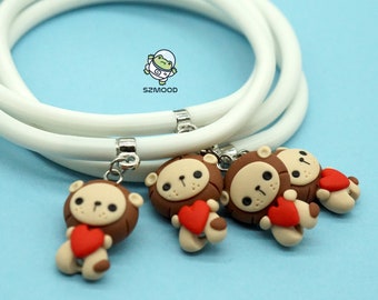 Rubber bracelet, adjustable to size, with handmade polymer clay pendant, lion